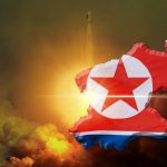 North Korea map with flag over rocket launch background