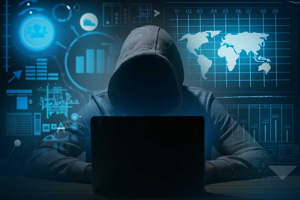 1669035211 featured image Hacker in hoodie using laptop with digital graphs