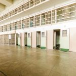 Trump’s Radical Move: Could Alcatraz Hold the Key to Safer Streets? Empty prison cells with open doors, two-story layout.