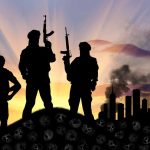 Silhouetted soldiers with rifles at sunset city background