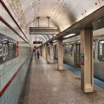 Chicago subway station platform with parked train.