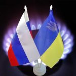 Russian and Ukrainian flags with gas burner background