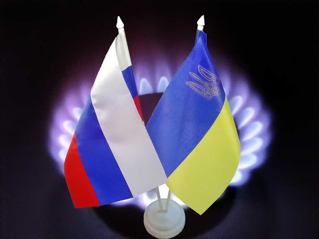Russian and Ukrainian flags with gas burner background
