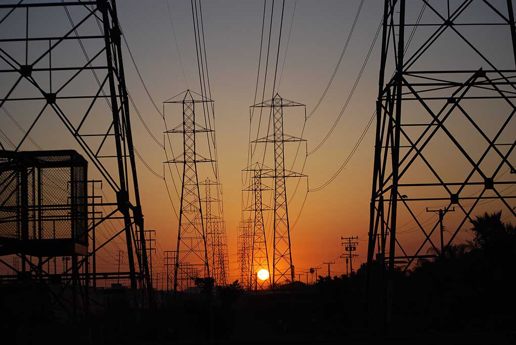 709070596 featured image Transmission towers at sunset
