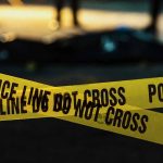 Clinic BOMBER Found DEAD in Detention Police tape marking a crime scene at night