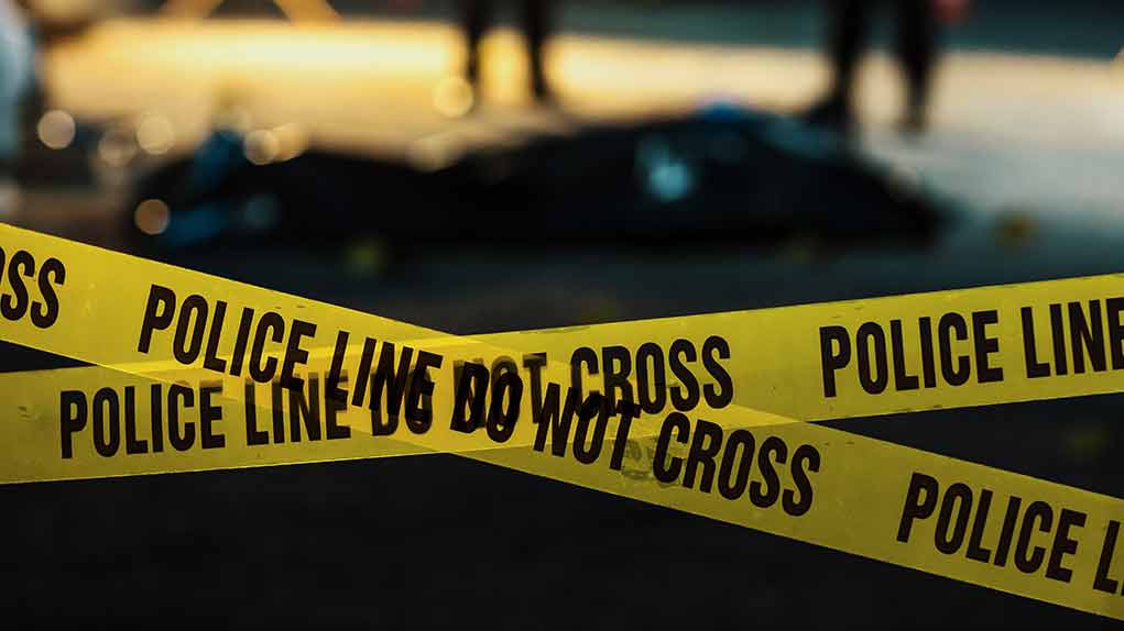 2230640045 featured image Police tape marking a crime scene at night