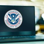 Massive DHS Move After Surge in Antisemitic Plots Laptop displaying US Department of Homeland Security logo