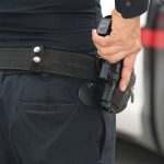 Armed Robbery ARREST Made – New Tech! Person holding a gun in a holster.