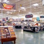 Supermarket interior with various food sections and displays
