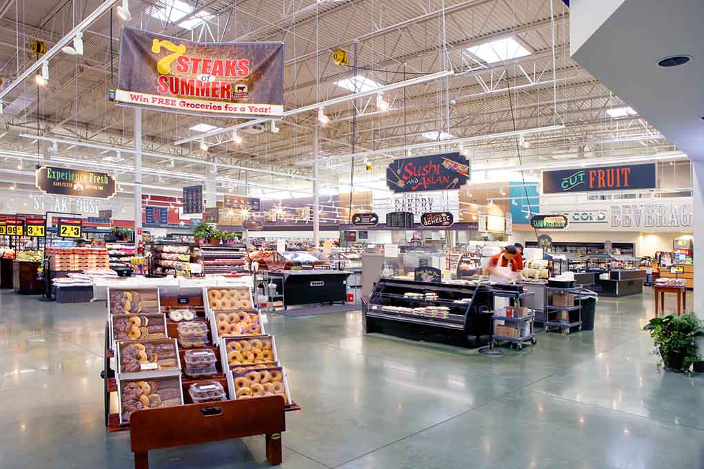 503073682 featured image Supermarket interior with various food sections and displays