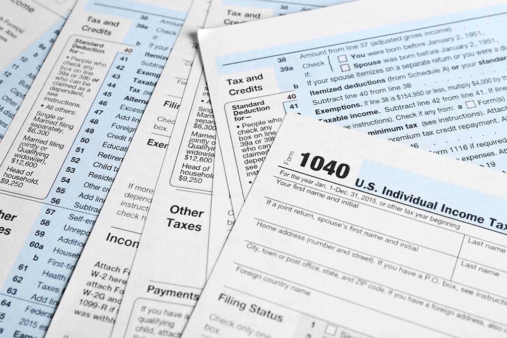 642440497 featured image Tax forms and documents overlapping on surface
