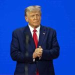 UNESCO Loses Big—Trump’s 2026 Exit Plan Revealed Man in a suit with a blue background