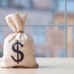 Pentagon Backs LeoLabs in SHOCK Tech Move Money bag with dollar sign on table