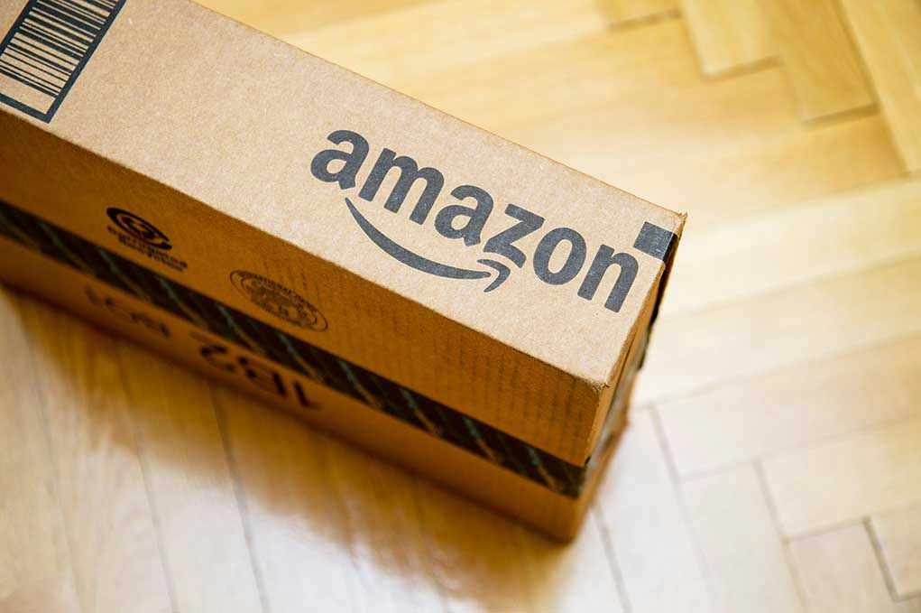 373709401 Amazon package on wooden floor