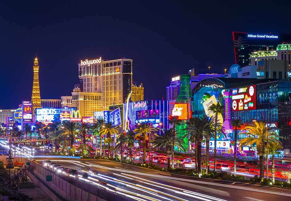 shutterstock_153923993.jpg Vibrant view of the Las Vegas Strip at night with neon lights and traffic