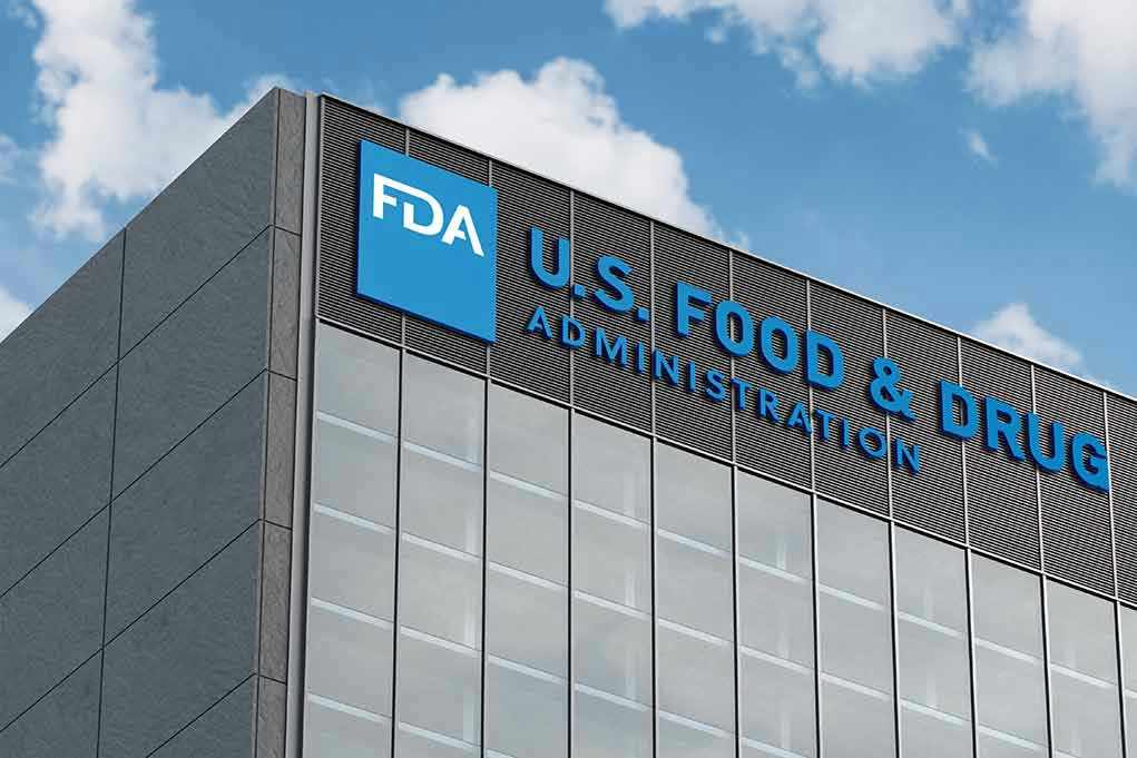 2454487921 FDA building with blue logo and sky background.