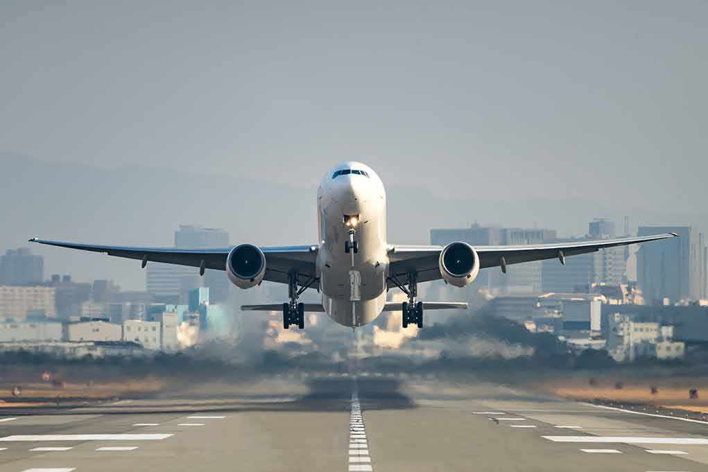shutterstock_559714906.jpg An airplane taking off from an airport runway
