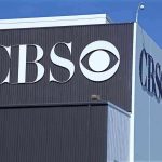 Conservative Enforcer at CBS – Media World Stunned! Exterior view of a CBS media building featuring the CBS logo