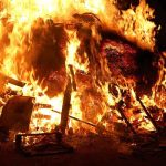 Historic Town BURNS – Governor Missing During Crisis A large fire engulfing debris at night