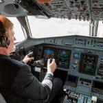 Instructor PLUMMETS — Student Dangling 50 Feet Pilot in cockpit operating airplane controls.