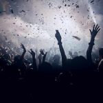 Rock Legend’s Collapse Shocks Music World Crowd celebrating under confetti and bright lights.