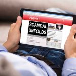 Affair Scandal Erupts After Aide’s Fiery Death Person reading tablet with headline Scandal Unfolds.