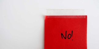 A red sticky note with the word 'No!' written in black ink