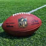 Beloved NFL ICON Shocking Arrest — WHAT HE DID! An NFL football resting on a green grass field