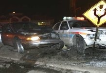 Armed Predator STRIKES Highway Crash Scene A damaged car and a police vehicle involved in a nighttime accident