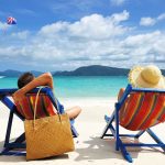 Cartel Shootout at Popular US Tourist Spot A couple relaxing on colorful beach chairs by the ocean