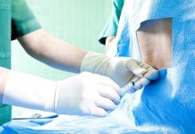 Counterfeit Skinny Jab KILLS Within Days Healthcare professional administering an injection to a patient in a surgical setting