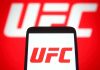 UFC Legend Ignites Political Firestorm UFC logo on phone screen and background.