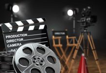 Horror Film Set FATALITY — Veteran Crew ELECTROCUTED Movie set with film reels and clapperboard.