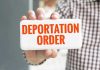 ICE Targets New Locations Hand holding sign with Deportation Order text.