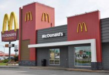 McDonalds restaurant exterior with logo and drive-thru sign.