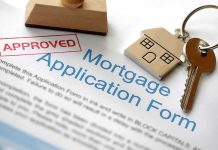50-Year Mortgages: The Debt Trap Looms Approved mortgage application form with a house key and keychain