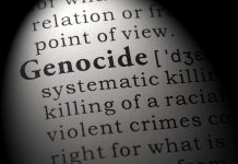 TRUMP WARNING Ignored — Another Massacre Erupts in Nigeria Close-up of the word Genocide in a dictionary with its definition