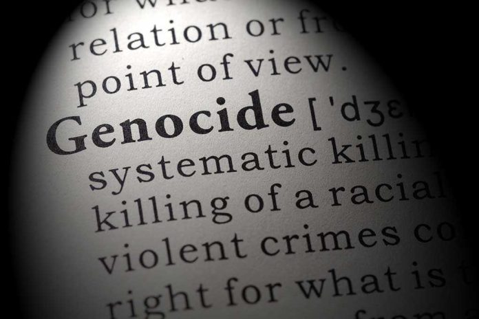 shutterstock_1245593167 (1).jpg Close-up of the word Genocide in a dictionary with its definition
