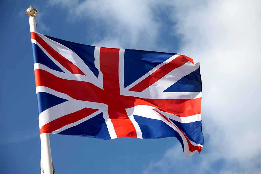 British flag waving against a blue sky