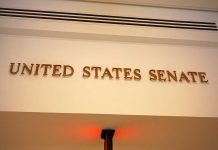Desperate Filibuster Battle — What it Takes to WIN Sign displaying United States Senate in a government building
