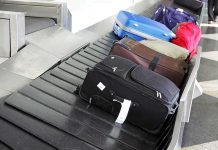 Mother Hides Bodies In Suitcases For YEARS Various suitcases on an airport luggage carousel