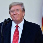 Dems Moved Fast to Block Trump’s Name Man in suit and tie speaking at podium.