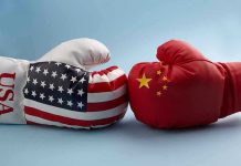 US–China Standoff ERUPTS! USA and China boxing gloves facing each other.
