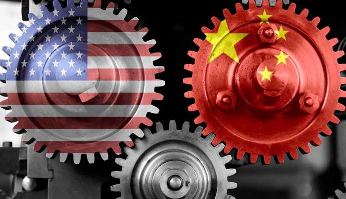 1849129522 Interlocking gears with USA and China flags.