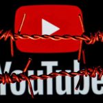 YouTube logo behind barbed wire lines.