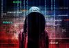 Terrifying New Scam Drains Pensions Overnight Hooded figure with cybersecurity terms and binary code background.