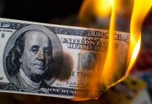 Labour’s Brutal Pension ASSAULT Backfires Spectacularly Burning hundred-dollar bill with visible flames.