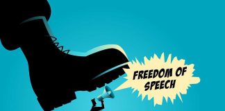 A man holding a megaphone under a large boot, symbolizing censorship of free speech
