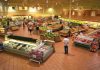 Interior of a grocery store filled with fresh produce and shoppers