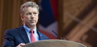 A man speaking at a podium during a political conference